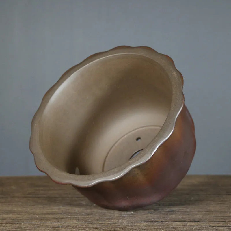 Antique carved ceramic flower pot with purple sand finish and wood burning texture