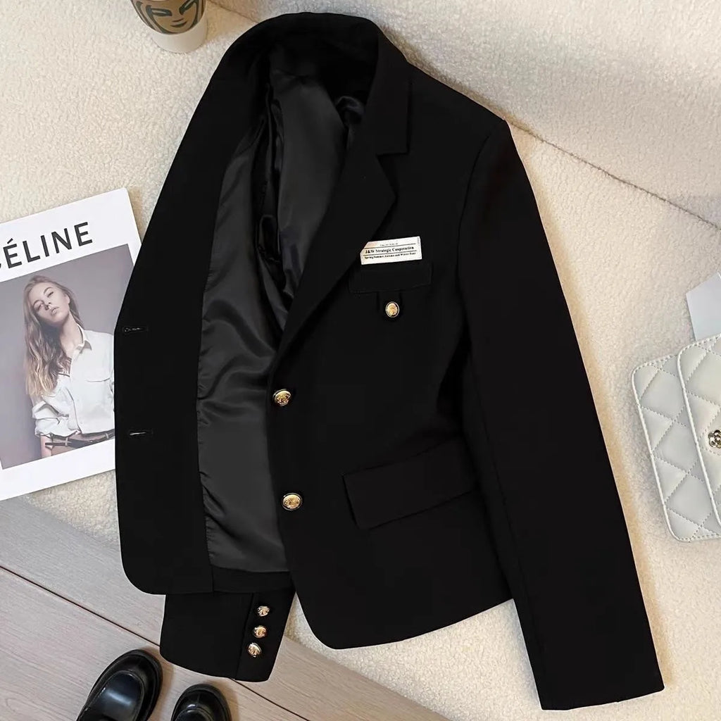 Women's black short suit coat with loose fit design and long sleeves