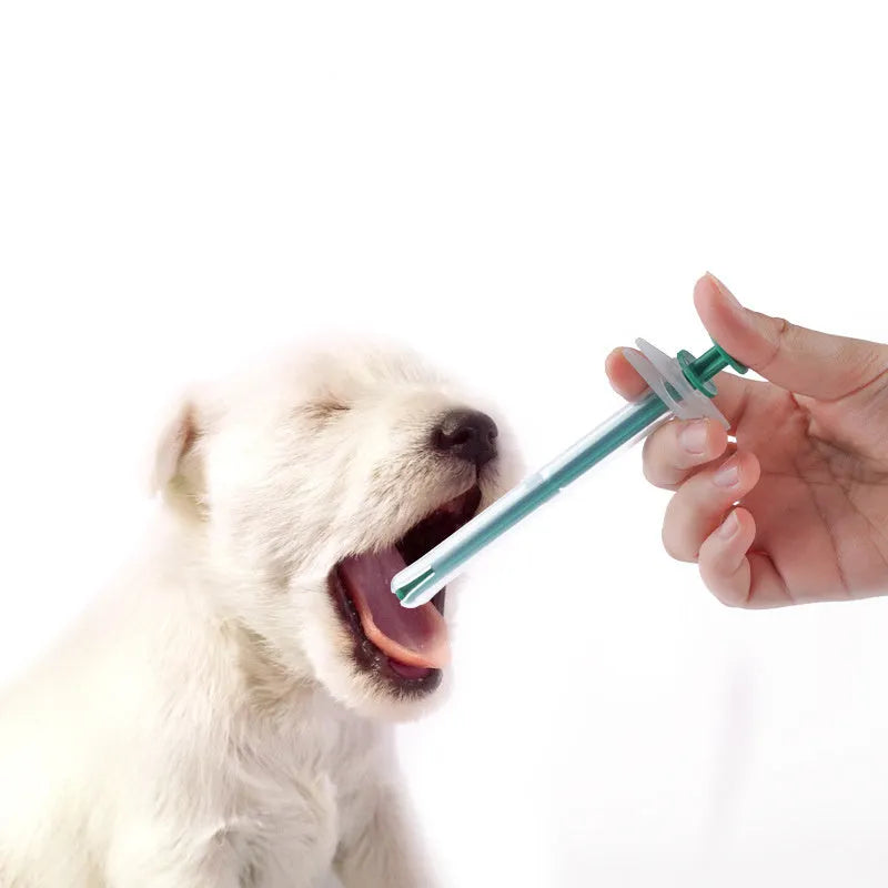 Two pet pill shooters with soft silicone tips, different sizes, for administering medicine to cats and dogs.