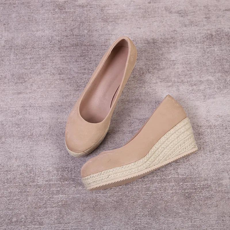 Women's wedge heel pumps with thick rope-bottom soles and shallow open-toe design