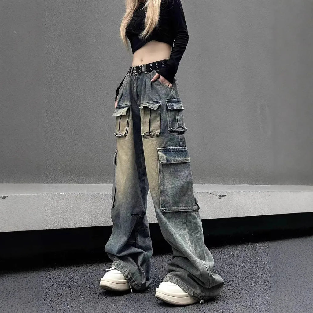 Man wearing light blue loose-fit distressed jeans with multiple pockets, showcasing street hipster style.
