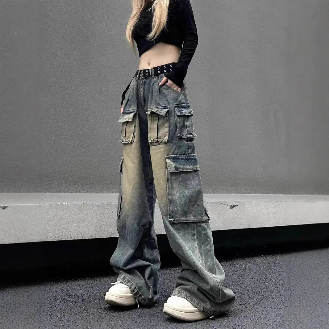 Man wearing light blue loose-fit distressed jeans with multiple pockets, showcasing street hipster style.