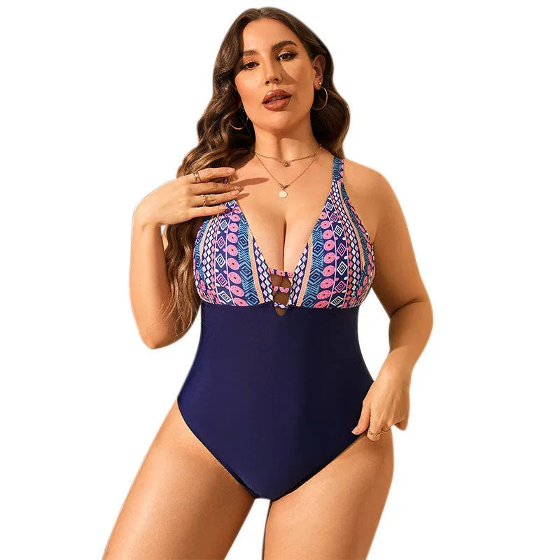 Plus size women's one-piece swimsuit in leopard print with V-neck and conservative cover-belly design.