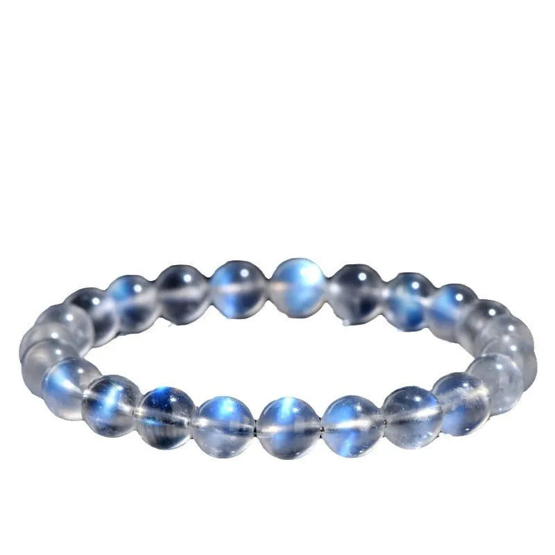 Natural cream body blue moonlight crystal bracelet on a wrist, showing single circle format.