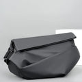 Grey medium crossbody bag with zipper opening showing internal phone and document compartments
