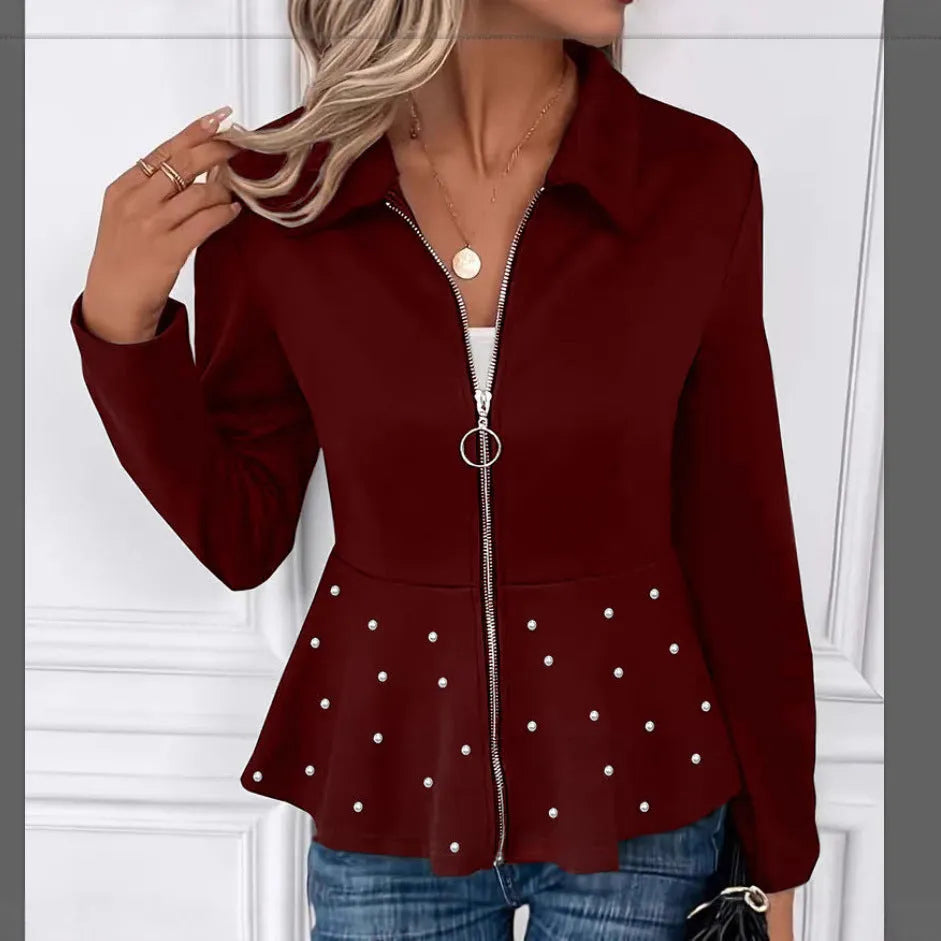 Women's black loose-fit coat with heavy-duty zipper front and ruffled hem detail.