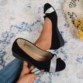 Black women's slip-on casual shoes with rhinestones on the toe and a chunky heel.