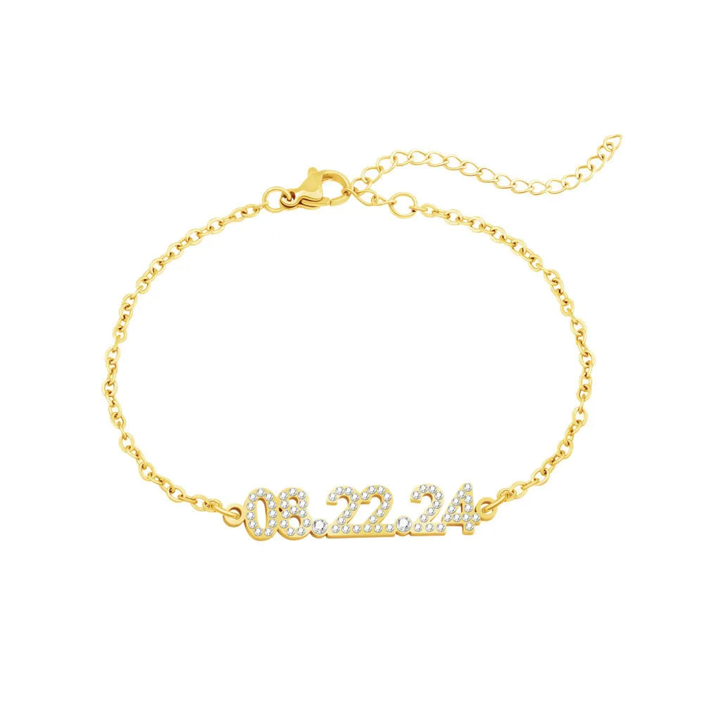 Stainless steel digital bracelet with diamond-set numbers on display, shown in gold colour.