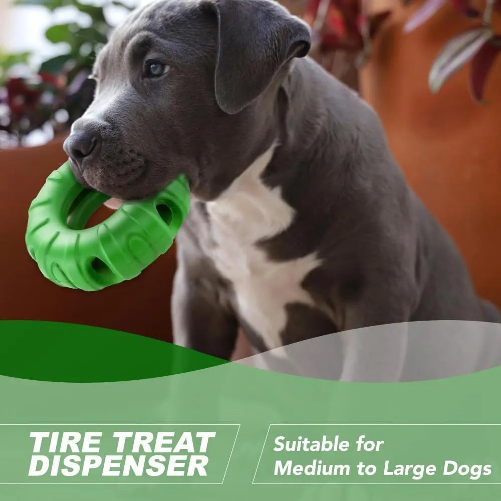 Blue natural rubber tyre-shaped dog chew toy and slow feeder with oval openings for treat dispensing.