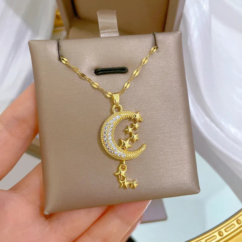 Moon pendant necklace with geometric tassel design and diamond arrangement on stainless steel chain