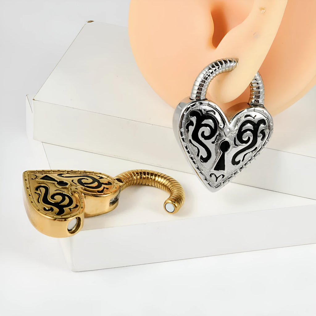 Close-up of a women's stainless steel heart-shaped ear piercing in a gold colour finish.