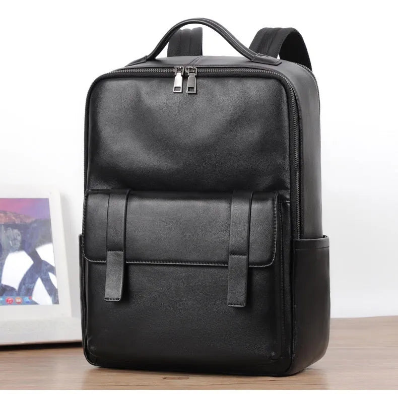 Black genuine leather men's computer backpack with large 55L capacity shown from a side angle.
