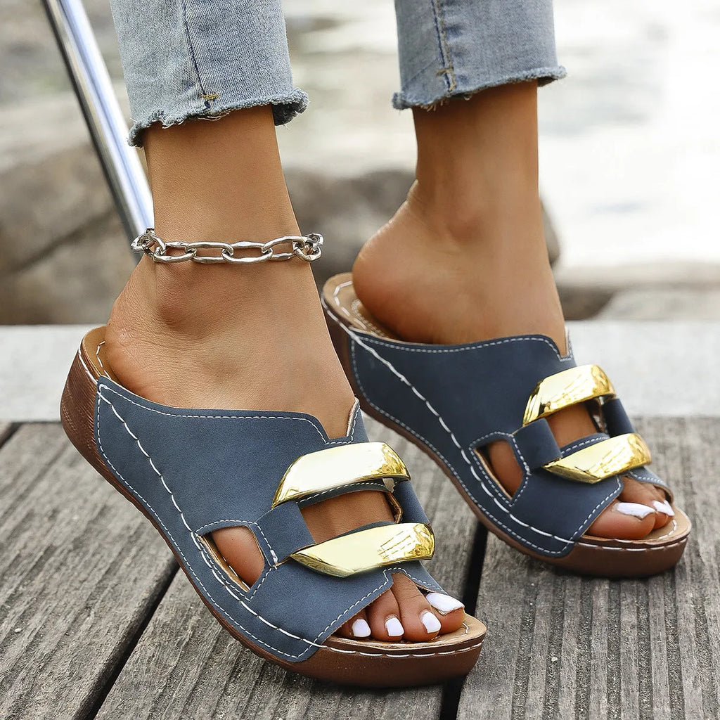 Roman style platform flip-flops in solid colour with metal decorative elements and rubber sole