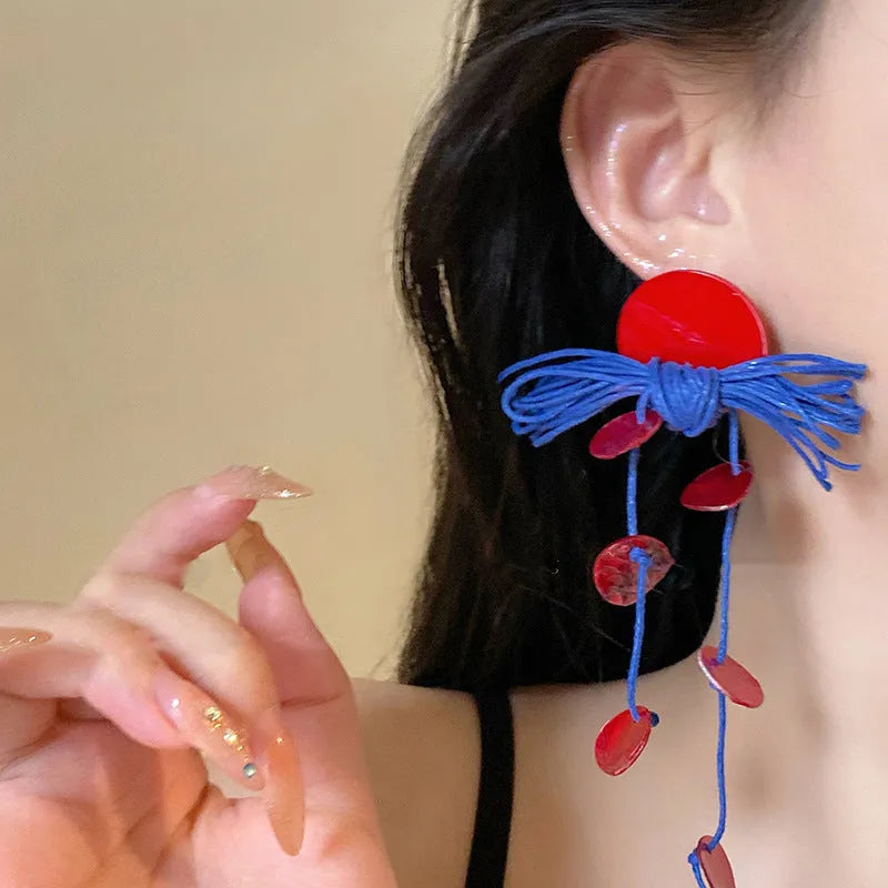 Geometric women's earrings with cloth construction, silver needle and blue resin flower accents