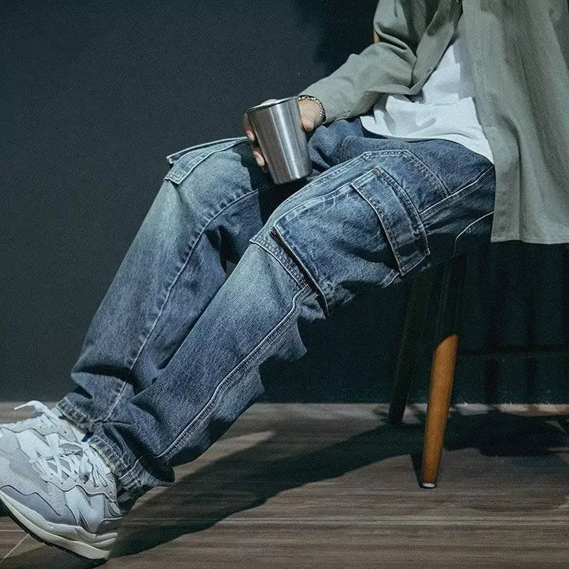 Men's blue loose straight-leg stretch denim casual trousers on a plain background