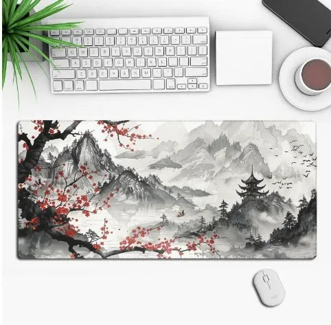 Large black gaming mouse pad with colourful anime character graphic on a desk with keyboard and mouse.
