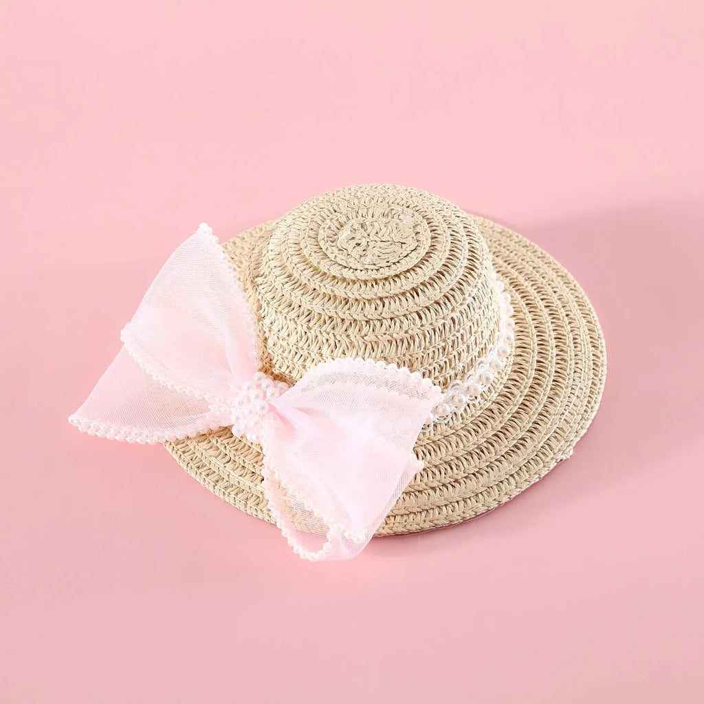Woven Lafite leaves straw hat with pearl bow on a cat, showing pink pearl colour option in S 13cm size.