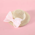 Woven Lafite leaves straw hat with pearl bow on a cat, showing pink pearl colour option in S 13cm size.