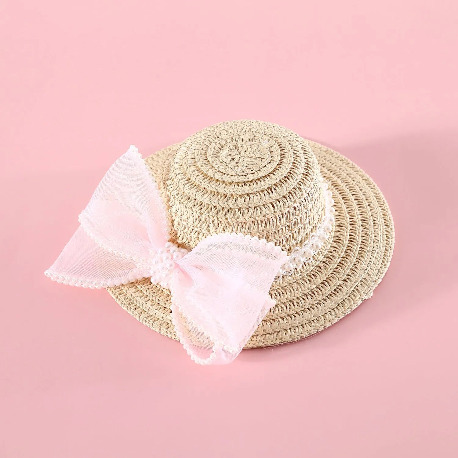 Woven Lafite leaves straw hat with pearl bow on a cat, showing pink pearl colour option in S 13cm size.