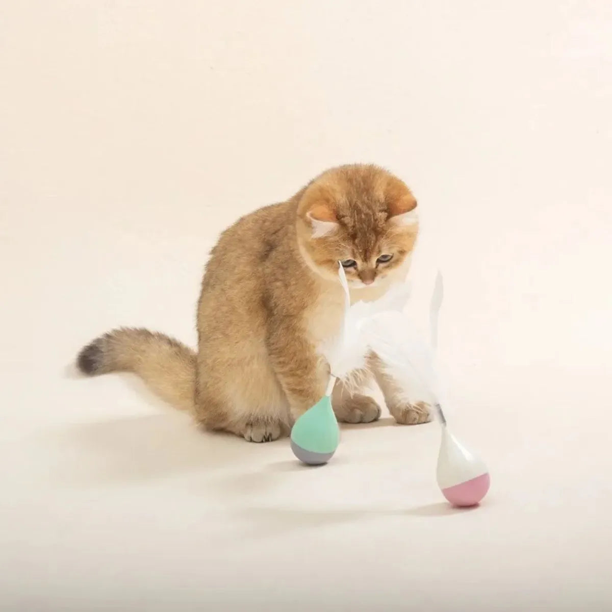 Green and pink feather tumbler cat toy with aluminium alloy frame and self-healing design