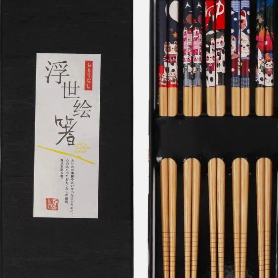Five pairs of Japanese-style patterned bamboo chopsticks in lucky cat or elegant blue designs with cartoon patterns