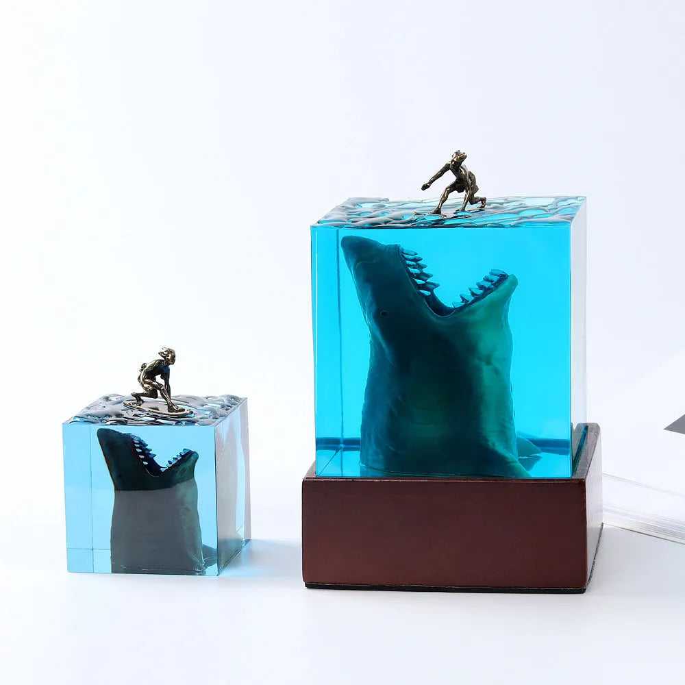 Epoxy resin shark surf scene night light ornament in 5cm and 8cm sizes on a table.