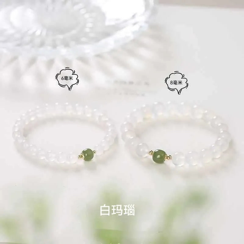 Handmade white agate and crystal bracelet with cinnabar inlay, showing 6mm or 8mm bead size.