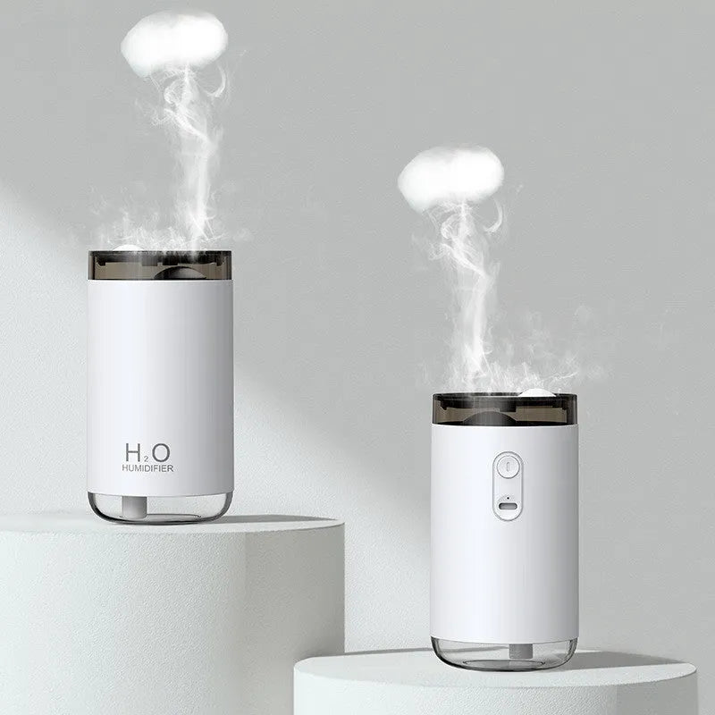 White jellyfish-themed USB humidifier with warm night light on a wooden table.
