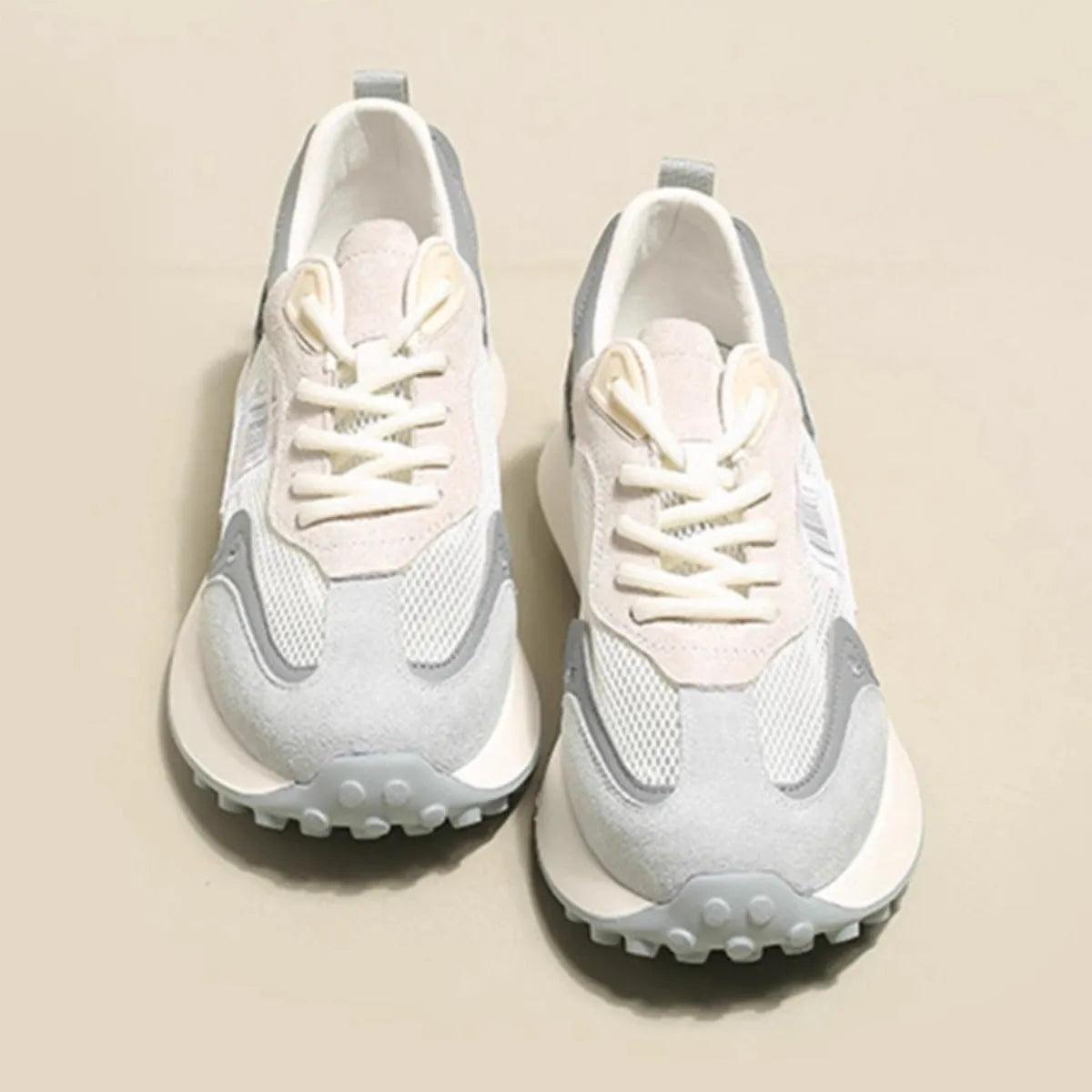 Women's grey and pink retro sneakers with rubber soles and mesh lining in low-top design