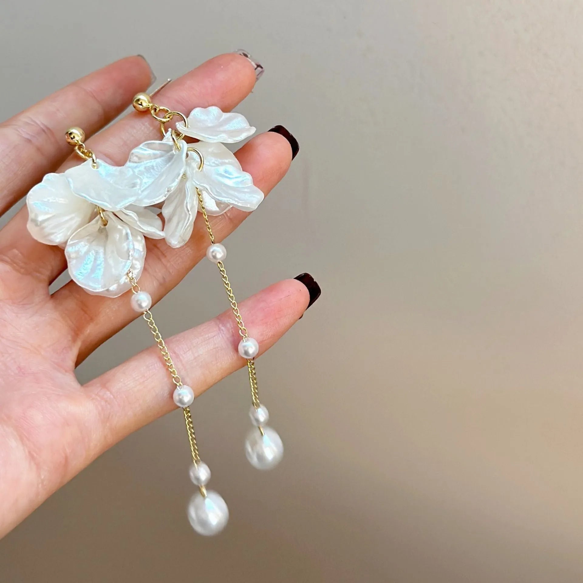 Women's acrylic shell pearl tassel earrings with approximately 8.8cm length and multiple clip options