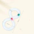 Blue and white plastic cat turntable track ball toy with a teasing stick on a flat surface.