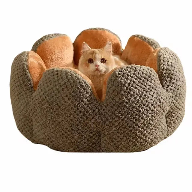 Green cactus petal shaped enclosed pet bed for cats and dogs on a hardwood floor.