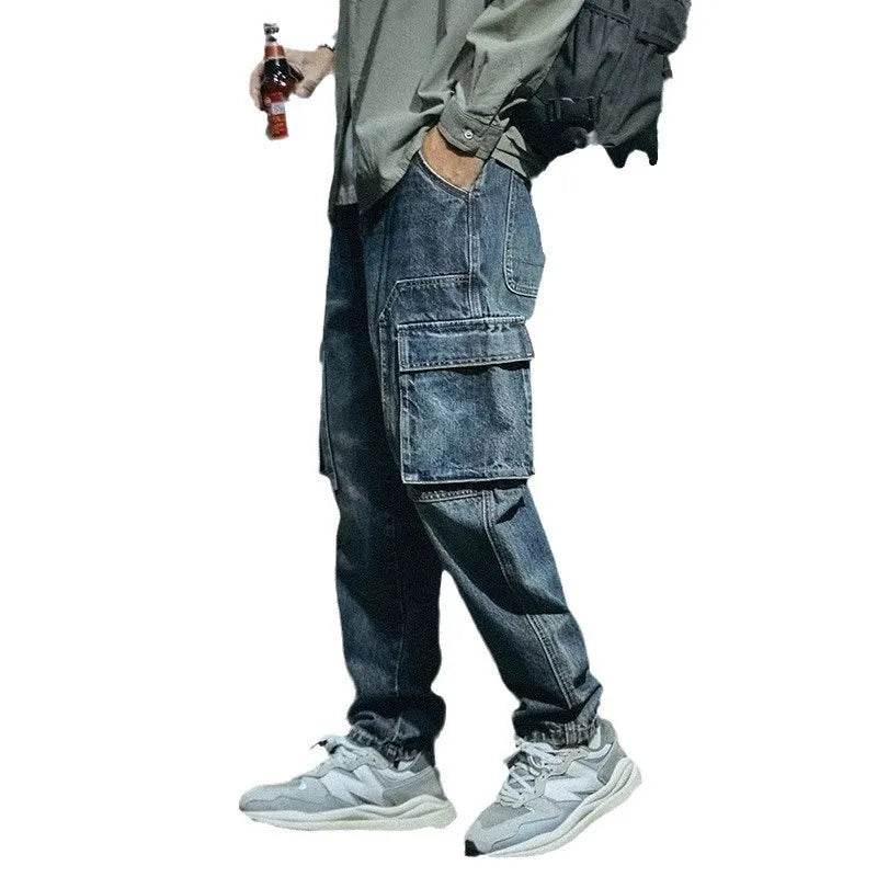 Men's blue loose straight-leg stretch denim casual trousers on a plain background