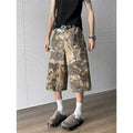 Yellow jeans with snake pattern camouflage design and cropped length