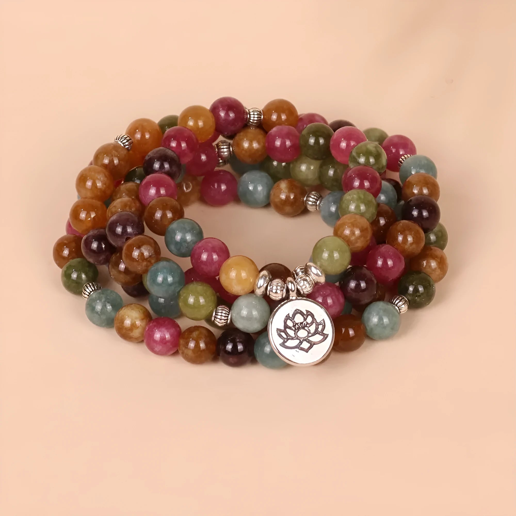 108-bead lotus hanging multi-layer bracelet in tourmaline colour on wrist