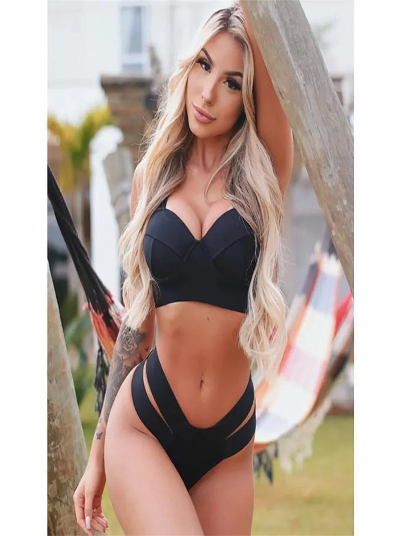 Women's rose red bikini with push-up support and separate pants laid flat.