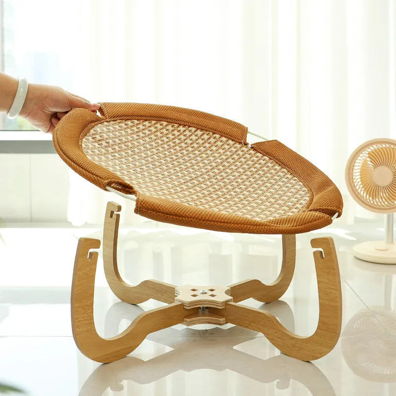 Brown woven rattan pet hammock bed measuring 46cm square with crib-style sides