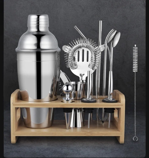 23-piece stainless steel cocktail set with acrylic mixing components on bar counter