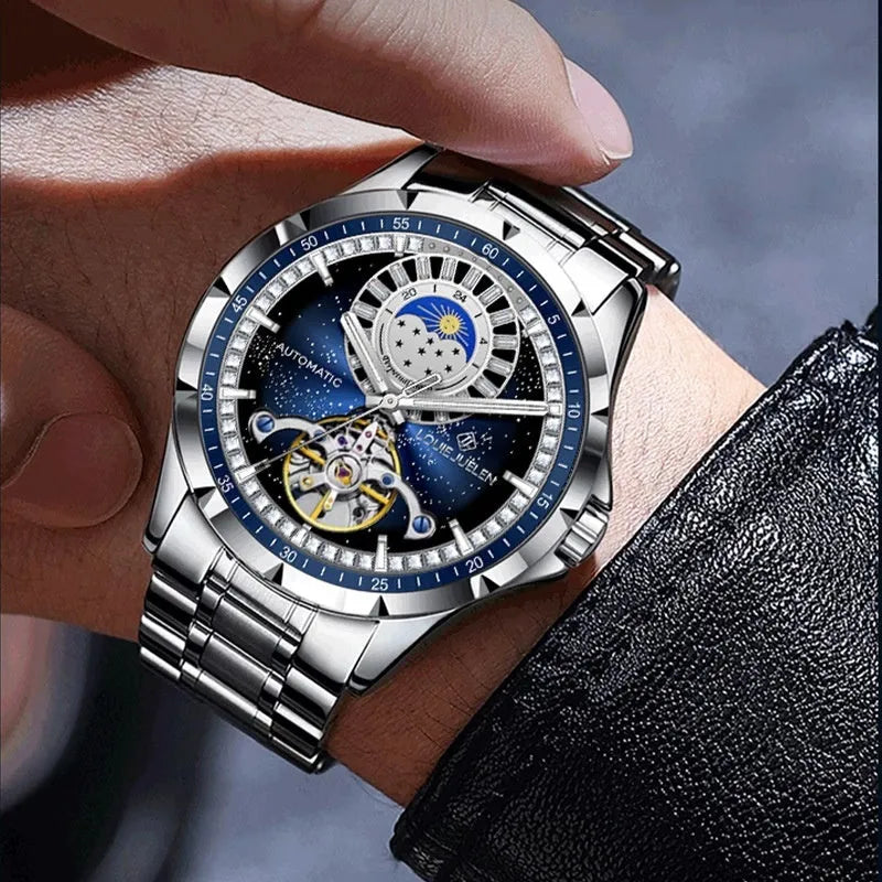 Men's silver alloy automatic watch with a blue circular dial on a stainless steel bracelet with a butterfly clasp.