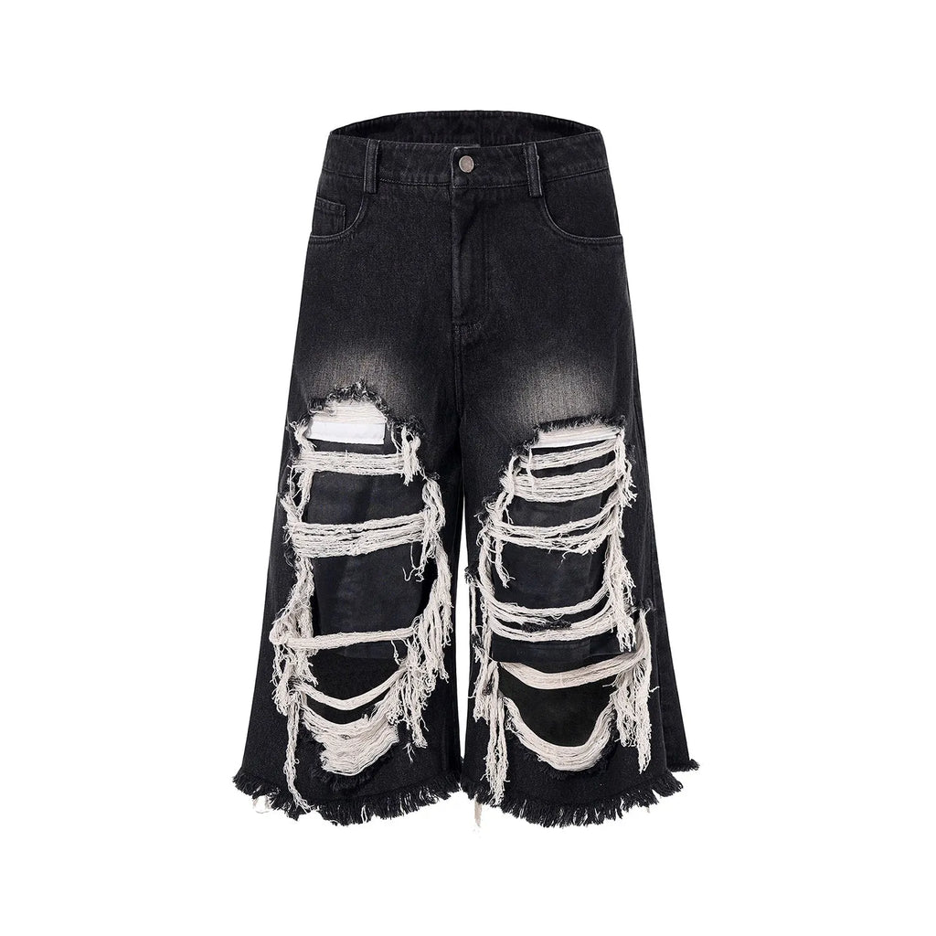 Black cropped wide leg jeans with ripped patch details and mid-high waist