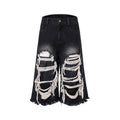 Black cropped wide leg jeans with ripped patch details and mid-high waist