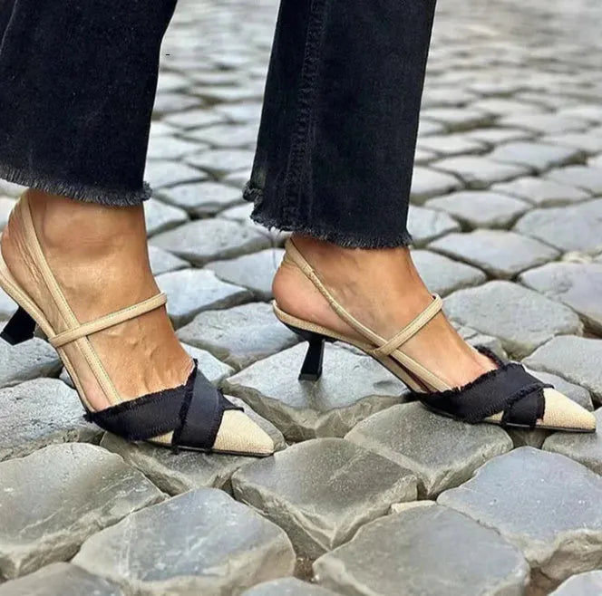 Women's apricot and black colour block stiletto sandals with a pointed toe and buckle fastening.