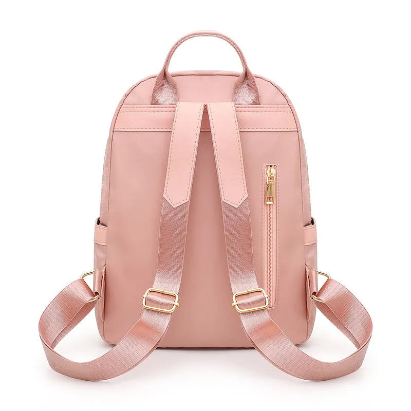 Women's nylon casual backpack in black with double shoulder straps and front pocket