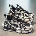 Men's black mesh sneaker with platform sole and lace-up front, showing cross-belt detail and round toe.