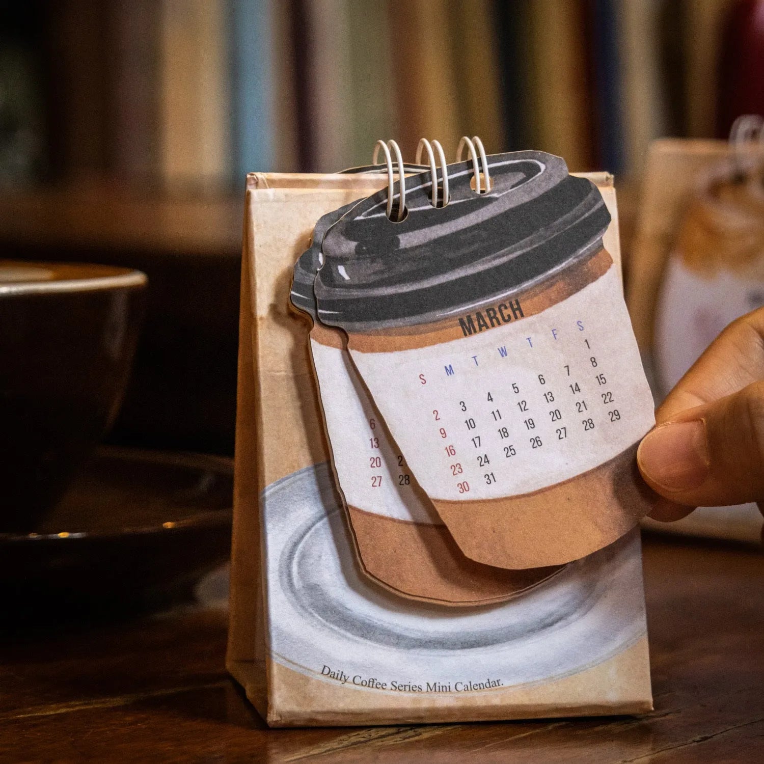 Mini paper desk calendar for 2025 with coffee theme and simple modern design