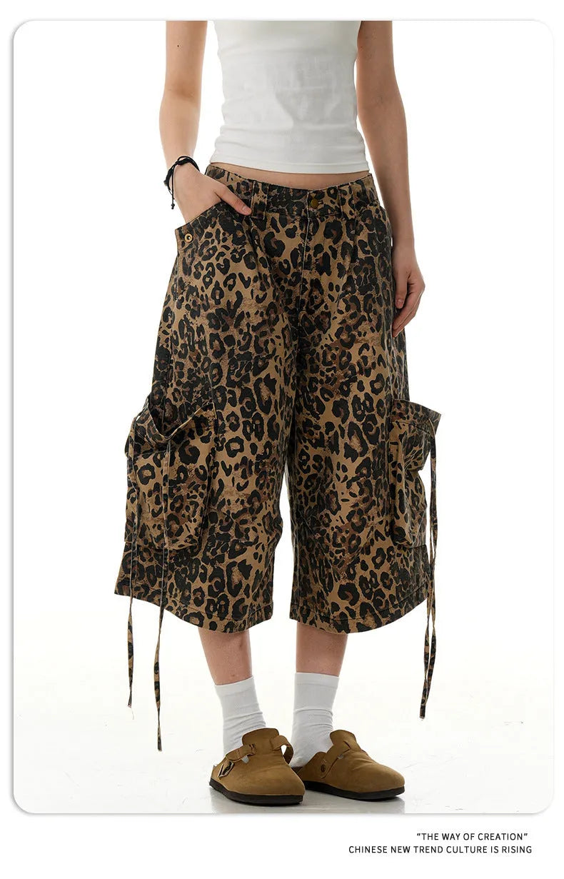 Leopard print high-waisted loose-fit cropped cotton trousers on a hanger