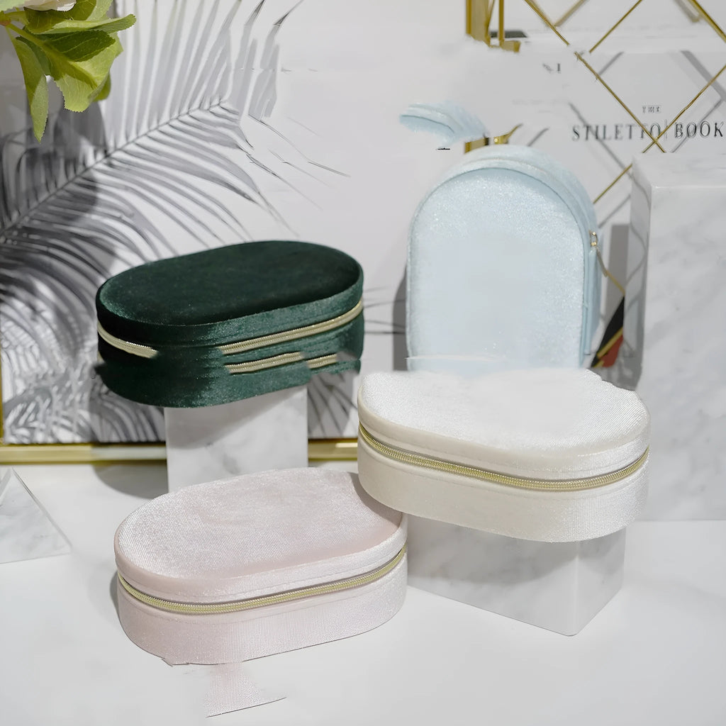 Oval velvet jewellery storage box in lake blue with soft flannel interior for ring and earring organisation.