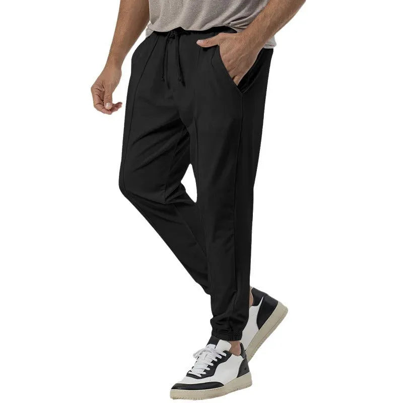 Men's grey cotton blend track sweatpants with straight leg design and elastic waistband