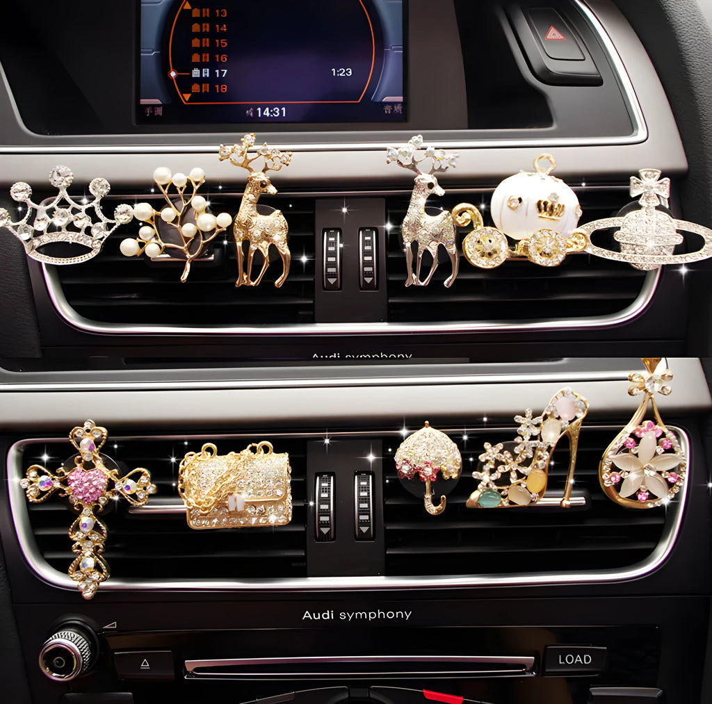 Alloy cartoon car air vent fragrance clip in one of twelve decorative styles.