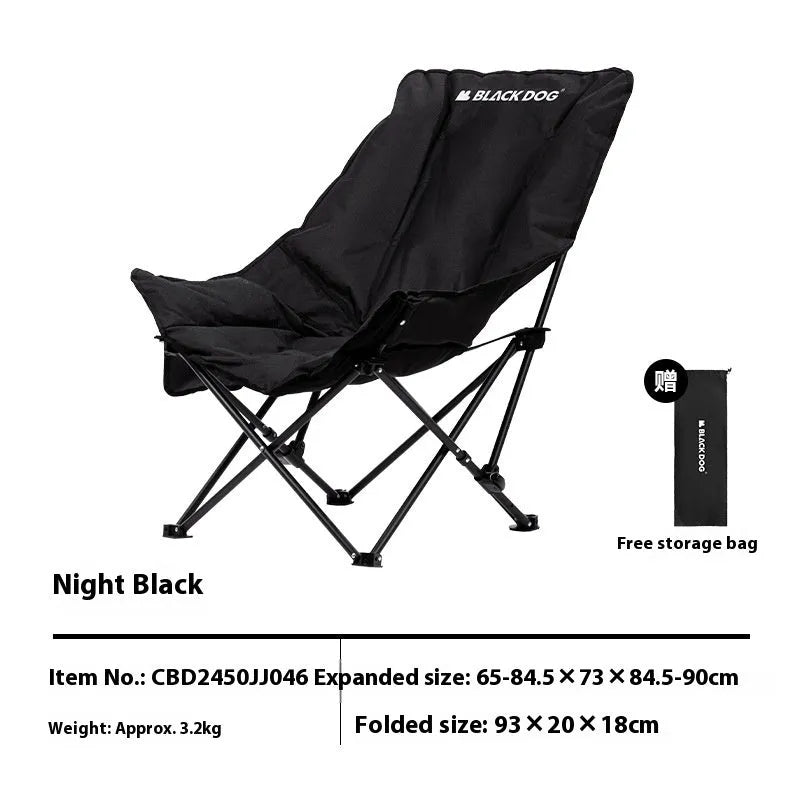 Night Black Oxford cloth folding moon chair in a reclined position on grass.
